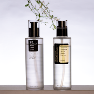 Minimalist photo of cosmetic serum bottles on a white background.