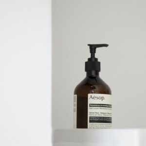 push bottle on silver surface