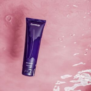 a tube of shampoo floating in a body of water
