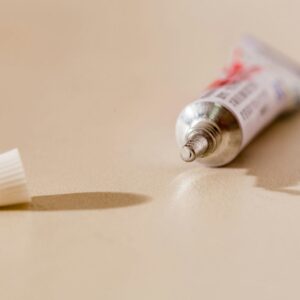 white tube bottle on white table